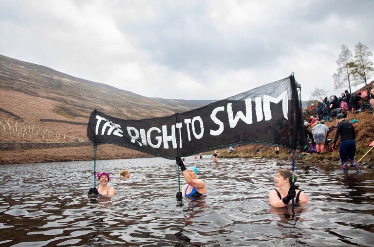 Swimmers at the chilly Kinder Reservoir near Hayfield in April advocating for public access to open spaces.