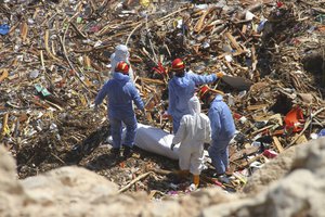 Rescue teams look for flash flood victims in the city of Derna, Libya, Monday, Sept. 18, 2023