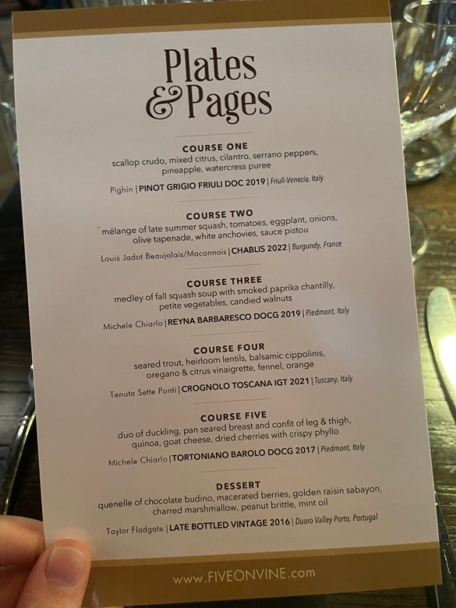 A menu that lays out each course and has all the details for each dish. It lists five courses, as well as dessert, and each of their wine pairings. 