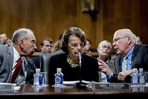 Senate Judiciary Committee Chairman Chuck Grassley, R-Iowa, left, accompanied by Sen. Dianne Feinstein, D-Calif., the ranking member, center, speaks with Sen. Patrick Leahy, D-Vt., right, during a Senate Judiciary Committee markup meeting on Capitol Hill, Thursday, Sept. 13, 2018, in Washington