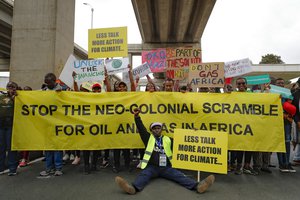 File - Protesters pose as they demand action on climate change, during a demonstration, in Nairobi, Kenya, Monday, Sept. 4, 2023, ahead of the Africa Climate Summit.