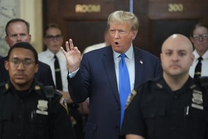 Donald Trump speaks to reporters during a lunch break at New York State Supreme Courthouse