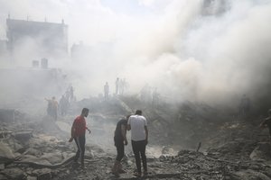 Palestinians look for survivors after an Israeli airstrike in Rafah refugee camp, southern Gaza Strip, Thursday, Oct. 12, 2023. As Israel escalates its war on Hamas, it will confront many of the same dilemmas it has grappled with over decades of conflict with the Palestinians. It will want to punish Hamas like never before, but without killing so many Palestinian civilians that it loses international support.