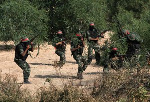 Militants with the Democratic Front for the Liberation of Palestine (DFLP) take part in a military training session, May 19, 2011, in the southern Gaza Strip town of Khan Yunis.(Photo By ahmed Deeb/wn)