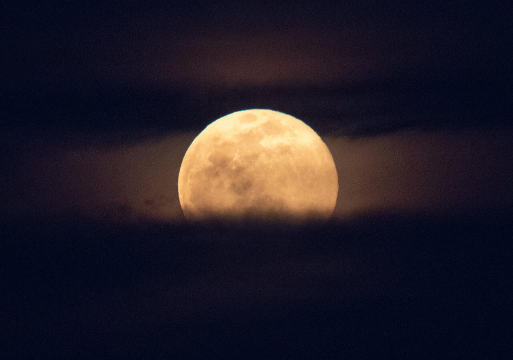 A supermoon rises behind the U.S. Capitol, Monday, March 9, 2020, in Washington. 