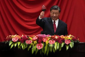 Chinese President Xi Jinping makes a toast after delivering his speech at a dinner marking the 74th anniversary of the founding of the People's Republic of China at the Great Hall of the People in Beijing, Thursday, Sept. 28, 2023.