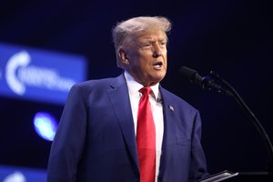 Donald Trump speaking with attendees at the 2023 Turning Point Action Conference in West Palm Beach, Florida