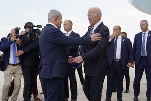 President Joe Biden is greeted by Israeli Prime Minister Benjamin Netanyahu after arriving at Ben Gurion International Airport, Wednesday, Oct. 18, 2023, in Tel Aviv