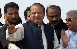 Deposed Pakistani Prime Minister Nawaz Sharif waves to his supporters during a rally in Muridke, Pakistan, Saturday, Aug. 12, 2017