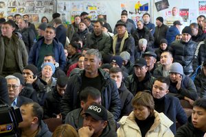 In this photo taken from video released by Kazakhstan's Presidential Press Office, people listens to Kazakh President Kassym-Jomart Tokayev as he expresses condolences to the families and friends of the miners who died in the fire in Karaganda, Kazakhstan, Saturday, Oct. 28, 2023.