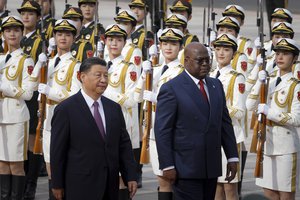 Congo's President Felix Tshisekedi, right, and Chinese President Xi Jinping attend a welcoming ceremony at the Great Hall of the People in Beijing, China