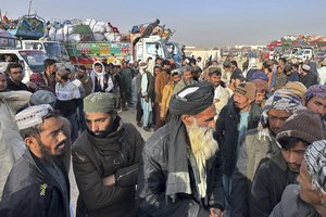 Afghans wait for clearance to depart for their homeland at a deportation camp set up by authorities to facilitate illegal immigrants, in Chaman, a town on the Pakistan-Afghanistan border, Wednesday, Nov. 1, 2023