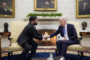 Joe Biden shakes hands with Chile's President Gabriel Boric in the Oval Office of the White House