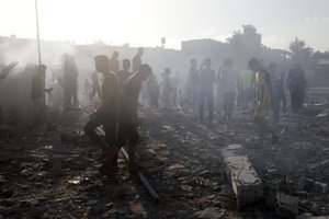 FILE - Palestinians inspect the damage of a destroyed mosque following an Israeli airstrike in Khan Younis refugee camp, southern Gaza Strip on Nov. 8, 2023. Entire generations of Palestinian families in the besieged Gaza Strip have been killed in airstrikes in the ongoing Hamas-Israel war.