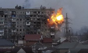 FILE - An explosion erupts from an apartment building after a Russian army tank fired on it in Mariupol, Ukraine, March 11, 2022. The image is part of the documentary "20 Days in Mariupol."