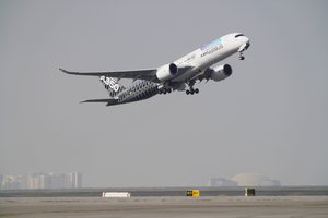 An Airbus A350 takes off at the Dubai Air Show in Dubai, United Arab Emirates, Wednesday, Nov. 17, 2021