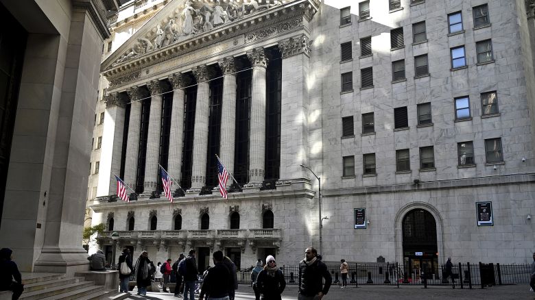 People walk outside of the New York Stock Exchange, New York, NY, November 3, 2023.