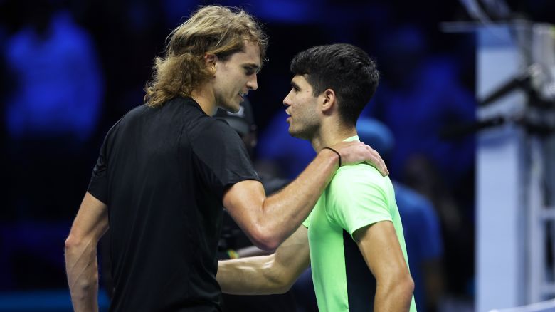 TURIN, ITALY - NOVEMBER 13:  Alexander Zverev of Germany shakes hands at the net after his three set victory against Carlos Alcaraz of Spain during the Round Robin match on day two of the Nitto ATP Finals at Pala Alpitour on November 13, 2023 in Turin, Italy. (Photo by Clive Brunskill/Getty Images)