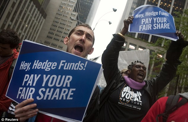 Demanding to be heard: Protesters brandish signs and yell outside the News Corporation building