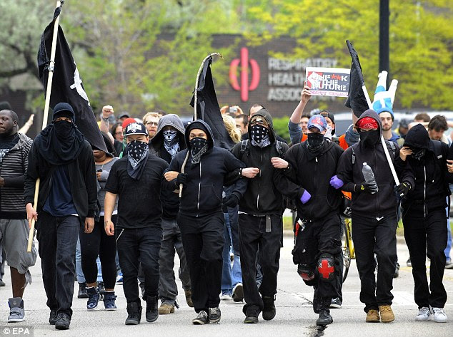 Intimidating: Occupy protestors join immigrant and workers' rights protesters in Chicago, lllinois