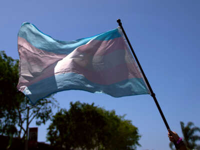 A Transgender Pride Flag is held during a march in West Hollywood, California, on April 9, 2023.