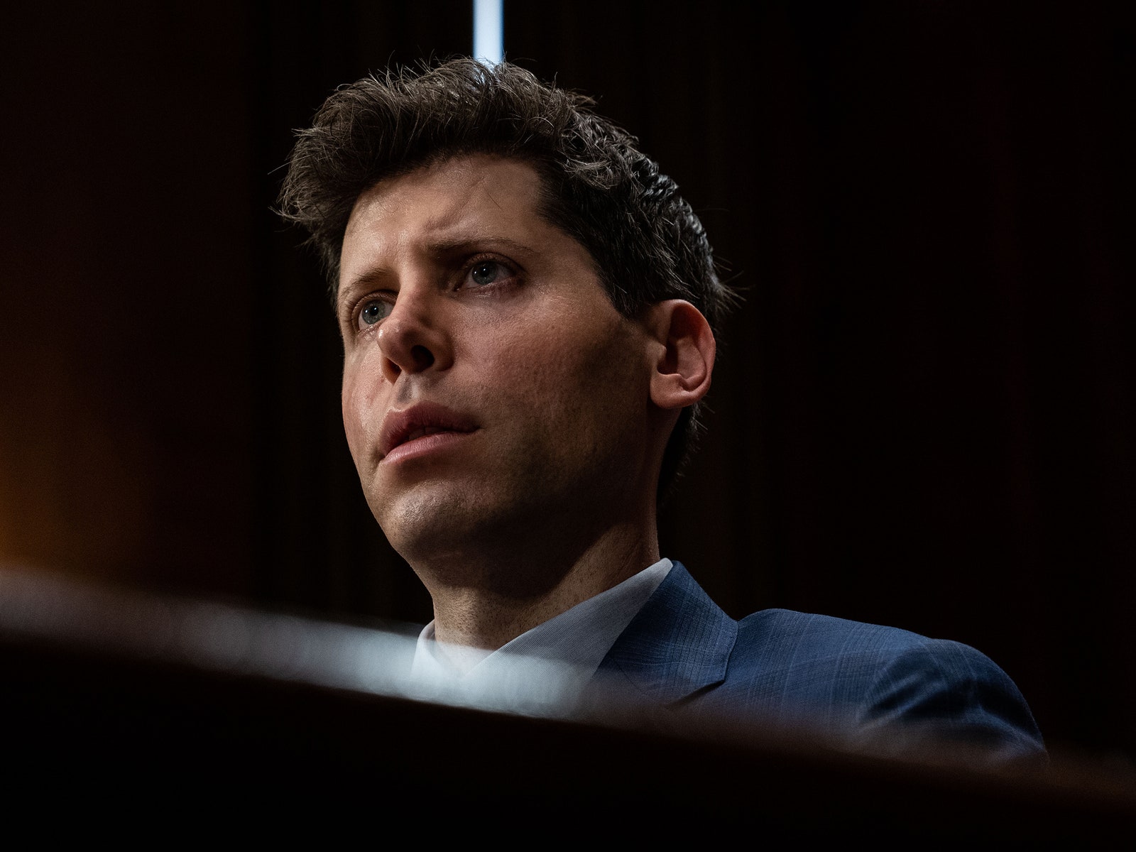 Sam Altman former CEO of OpenAI testifying at a Senate Judiciary Subcommittee oversight hearing in May 2023. He wears a...