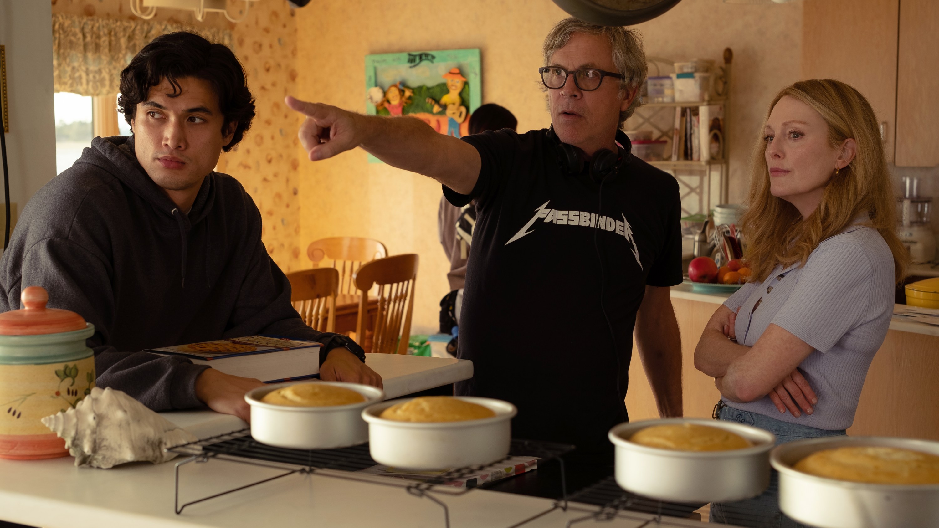 May December, L to R: Charles Melton as Joe, Todd Haynes Director and Julianne Moore as Gracie Atherton-Yoo. Cr. François Duhamel / Courtesy of Netflix