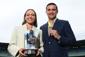 Kyah Simon of the Matildas poses with the Don Award, and Socceroos great Tim Cahill poses with his medal after being inducted into the Sport Australia Hall of Fame at a ceremony at the MCG on Friday.