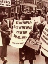 Picture of Black mothers holding protest signs in opposition against the Vietnam War