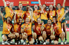 Australian players after winning the Dubai Sevens. 