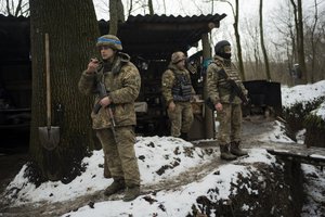 File - Soldiers of Ukraine's state border guard rest at the military position in Sumy region, Ukraine, Friday, Nov. 24, 2023. Nearly two years into the Russian invasion of Ukraine, instead of common crossing points between the two countries there are now military positions separated by the border.