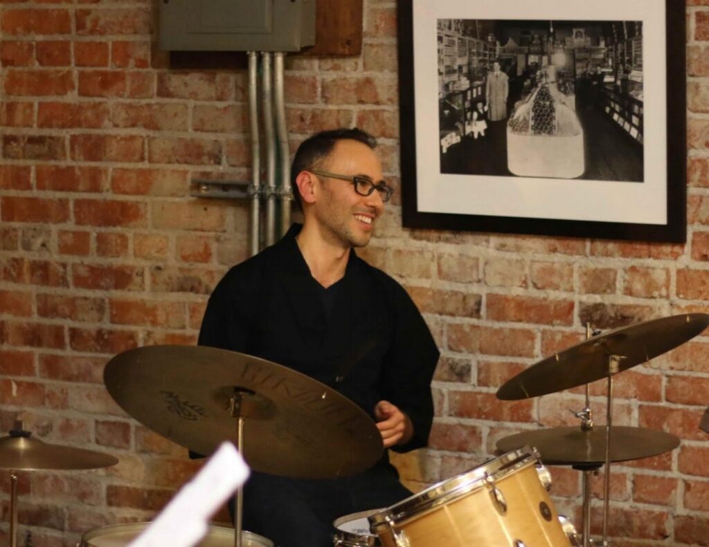 Paul Kikuchi playing drums