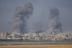 Smoke rises following an Israeli bombardment in the Gaza Strip, as seen from southern Israel on Monday, Dec. 11, 2023.