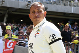 Usman Khawaja wears a black armband.