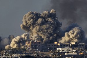 Smoke rises following an Israeli bombardment in the Gaza Strip, as seen from southern Israel, Saturday, Dec. 16, 2023.