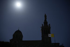 A Vatican Flag waves near the Notre Dame de la Garde Basilica in Marseille, southern France, the day Pope Francis arrives for a two-day visit