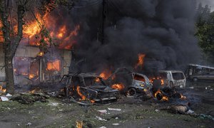 File - A dead body lies on the ground in front of a burning market after an attack in the city center of Kostiantynivka, Ukraine, Wednesday, Sept. 6, 2023.