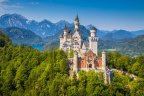 Fussen, Germany - August 7, 2015: Beautiful view of world-famous Neuschwanstein Castle, the nineteenth-century Romanesque Revival palace built for King Ludwig II on a rugged cliff, with scenic mountain landscape near Fussen, southwest Bavaria, Germany. SatApr29Germany