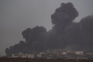 Smoke rises to the sky after an explosion in Gaza Strip as seen from Southern Israel, Saturday, Dec. 23, 2023.