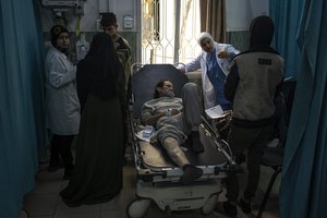 Palestinians who were arrested by the Israeli military in the north of the Gaza Strip and released through the Kerem Shalom crossing in the south wait for treatment in Rafah