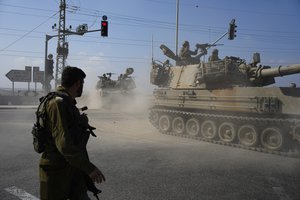 Israeli army tanks move towards the Gaza Strip border in southern Israel