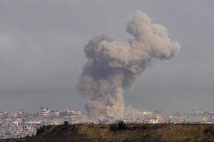 Smoke rises following an Israeli bombardment in the Gaza Strip, as seen from southern Israel, Wednesday, Dec. 27, 2023.