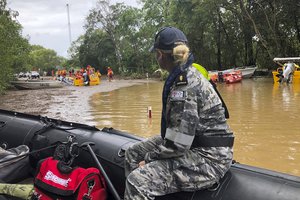 File - Royal Australian Navy personnel work with civilian emergency services to evacuate members of the public in Cairns, Australia, Monday, Dec. 18, 2023.