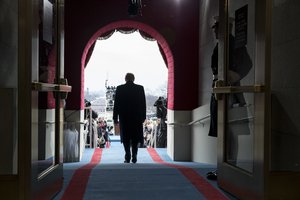 Donald Trump walks to take his seat for the inaugural swearing-in ceremony at the U.S. Capitol