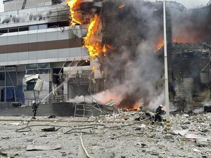 In this photo provided by the Ukrainian Emergency Service, firefighters work on a site of a building damaged after a Russian attack in Kyiv, Ukraine, Friday, Dec. 29, 2023.