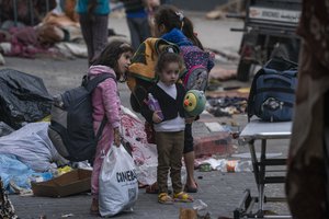 File - Children take refuge inside the Shifa Hospital during the war between Israel and Hamas in Gaza City on Wednesday, Nov. 22, 2023.