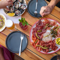 Kingfish sashimi, freshly shucked oysters with lime and dill granita and kampot pepper and Queen Vic Market deli meats at Brick Lane Market.