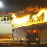 In this image made from video, a Japan Airlines plane is on fire on the runway of Haneda airport on Tuesday, Jan. 2, 2024 in Tokyo, Japan. (NTV via AP)