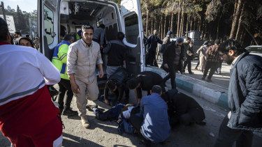 People taking care of the injured after an explosion in Kerman, Iran.