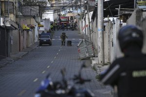 Police carry out a controlled explosion of a suspicious vehicle, parked a block from El Inca prison, in Quito, Ecuador, Wednesday, Jan. 10, 2024